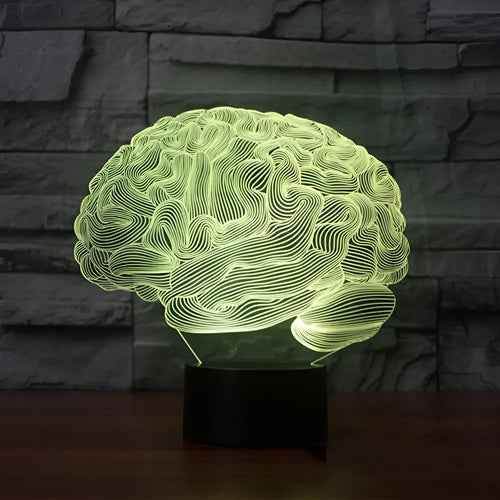 3D acrylic illusion LED desk lamp with colourful light display and remote control on a wooden surface