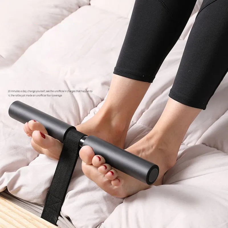 Black abdominal fitness device made from steel foam and PVC tube, 3.1 by 32 by 21.5 centimetres on a flat surface