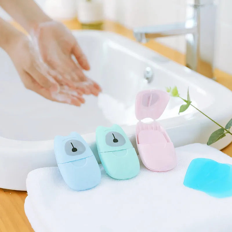 Pack of 50 biodegradable soap paper sheets in pink, blue, and green colours, 8x4.5cm size, for travel and outdoor hand cleaning