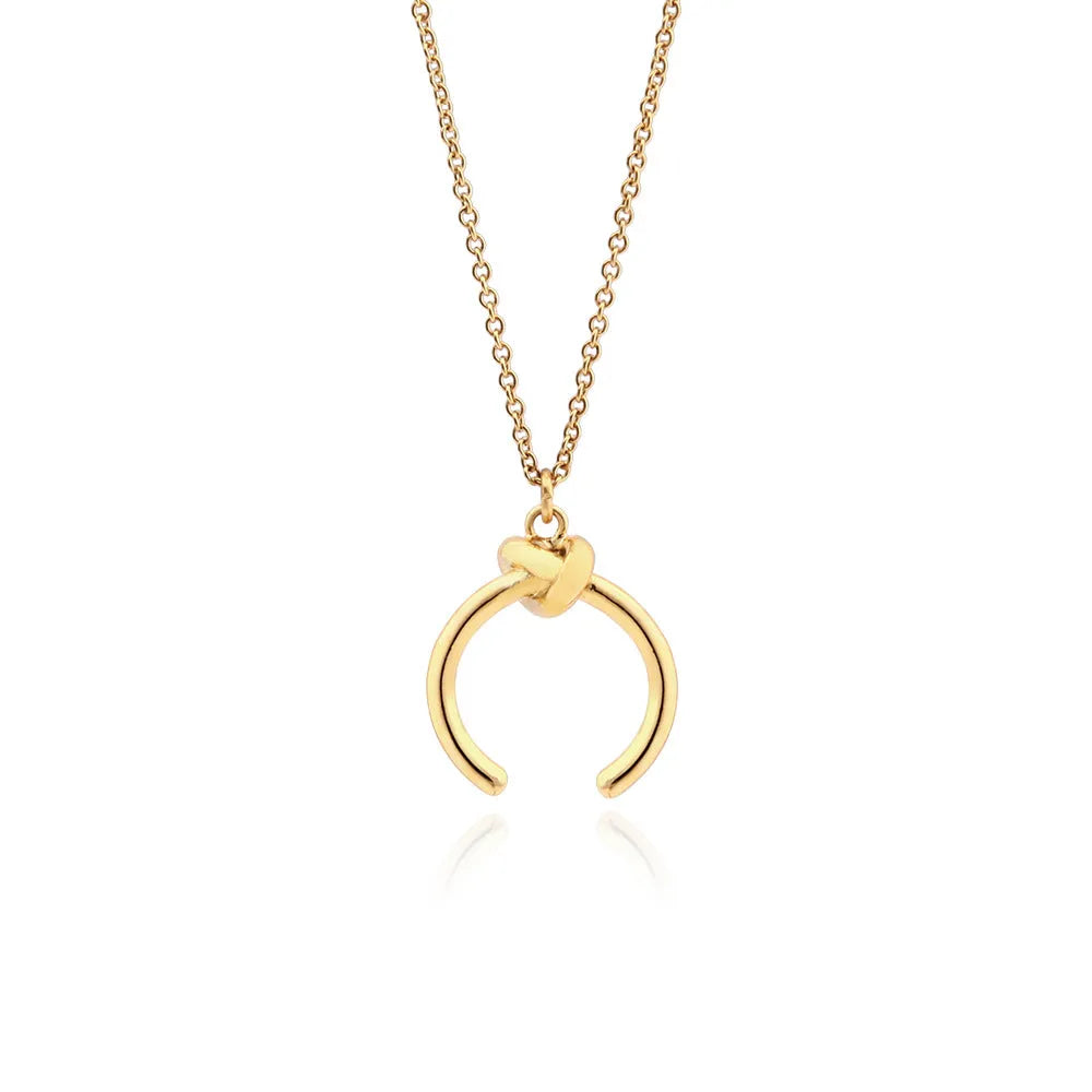 A vintage-style geometric pendant necklace with an adjustable copper chain in a gold finish.