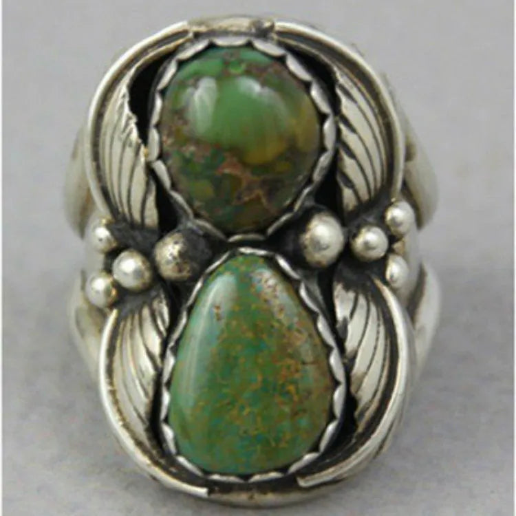 Turquoise geometric alloy ring with retro inlaid design on grey background