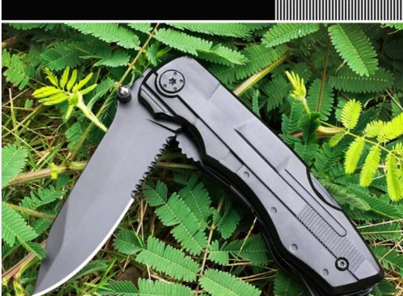 Black multi-purpose folding pliers tool with 7.5cm blade and aluminium handle on a flat surface