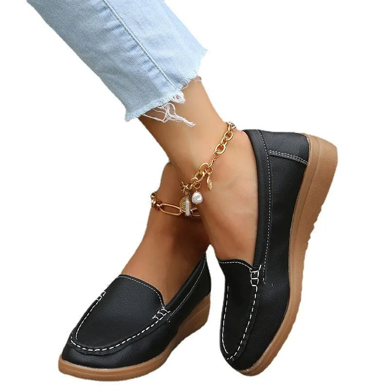 Women's flat loafer shoe in PU leather with a round toe and rubber sole, shown in a colour option.