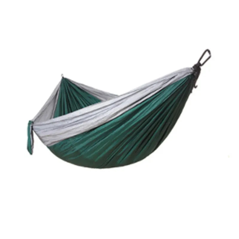 Double widened camping hammock 275x140cm in 210T nylon parachute fabric with steel buckles and ropes, shown outdoors in a garden setting