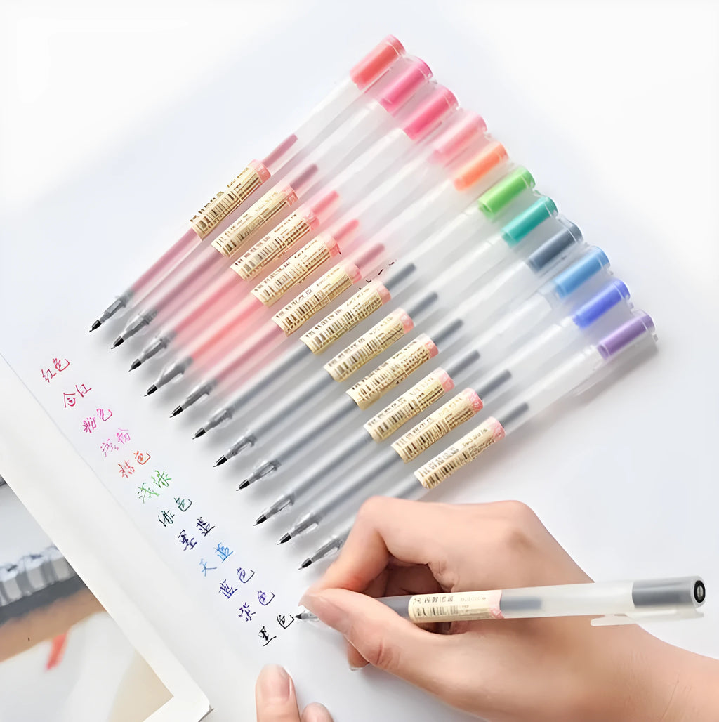 Pack of twelve black Muji 0.5mm gel pens with fine nibs, shown with pens uncapped.