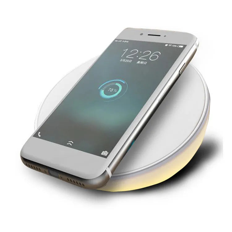 White wireless phone charger with digital clock display and control buttons