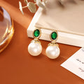 High-grade ruby pearl stud earrings with real gold plating on copper base, geometric round shape, red colour
