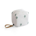Blue cloth cube-shaped makeup storage bag on a plain background.