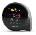 Black wireless weather forecast clock with outdoor sensor showing temperature and humidity on colour LED display