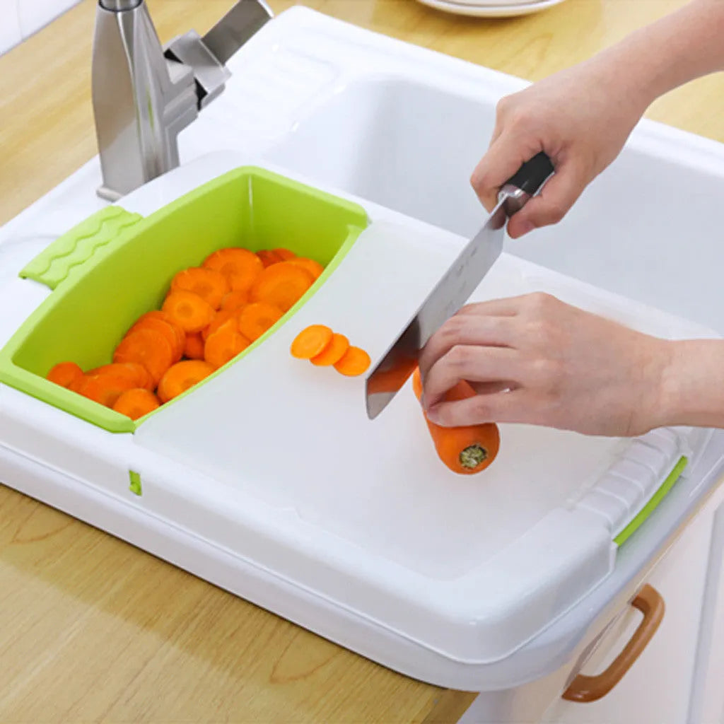 Green multi-function kitchen cutting board with drainage holes mounted on a sink edge