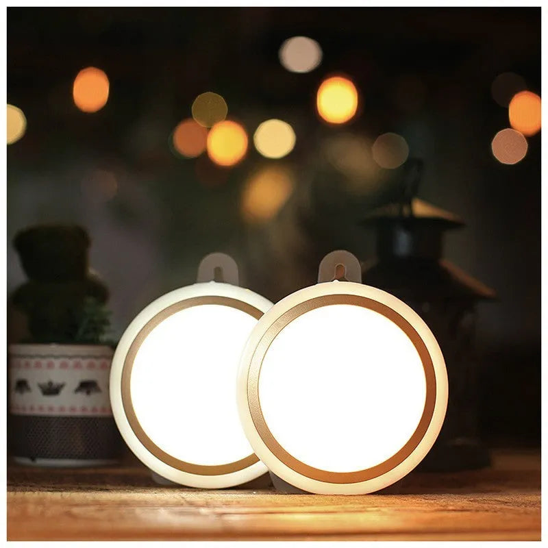 Round white motion sensor LED light unit, 80mm in diameter, for wardrobes and corridors.