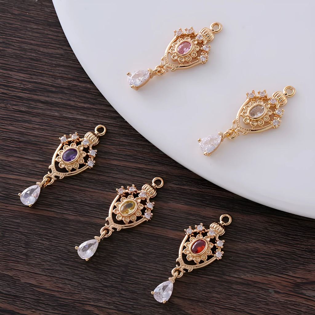 Crown motif water drop pendant with micro inlaid zircon on a copper base.