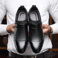 Men's black business formal PU leather shoes with non-slip rubber sole on a grey background