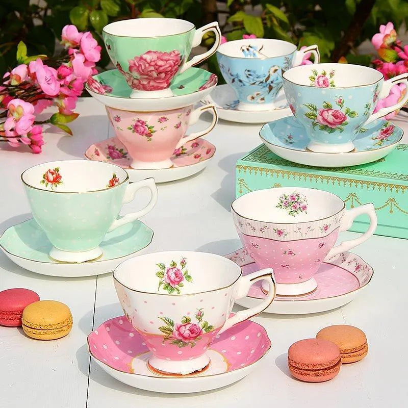 European style porcelain coffee cup set with saucer and pastoral ceramic plates on a dining table