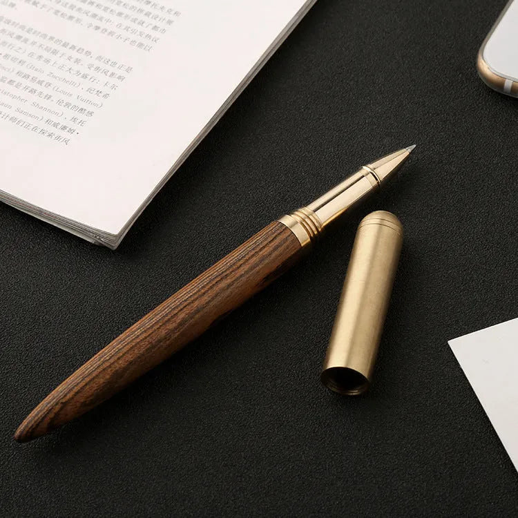Brass sandalwood signature pen with wood grain visible on 14cm long writing instrument