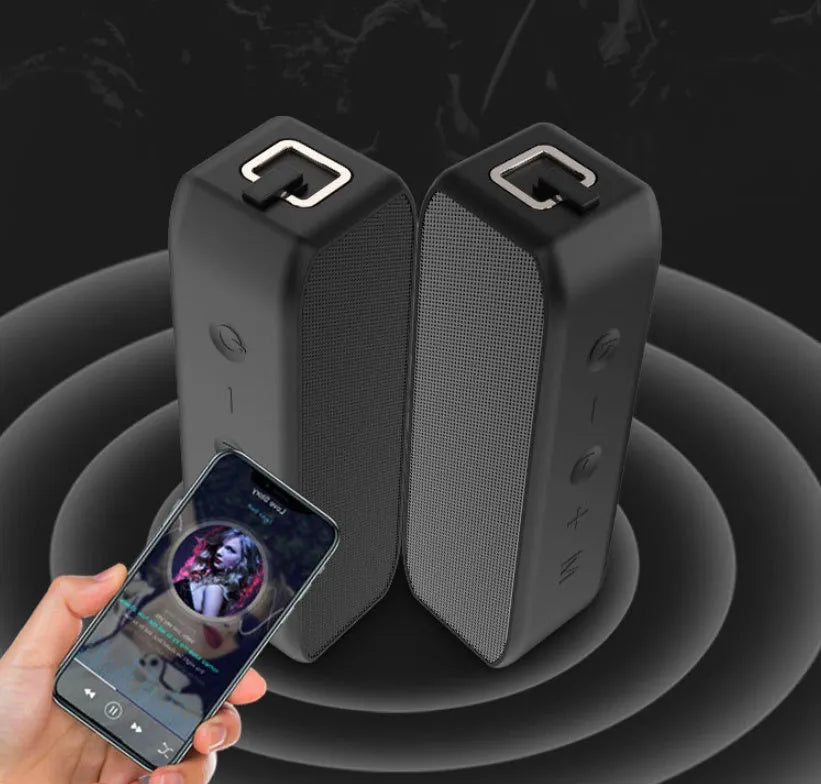Black portable wireless Bluetooth speaker with waterproof construction and 20W output power
