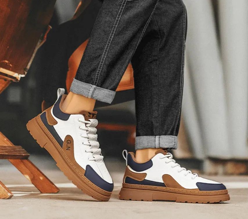 Black and white platform casual sneakers with thick rubber soles and colour-panelled pattern detailing