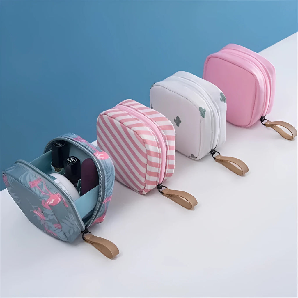 Blue cloth cube-shaped makeup storage bag on a plain background.