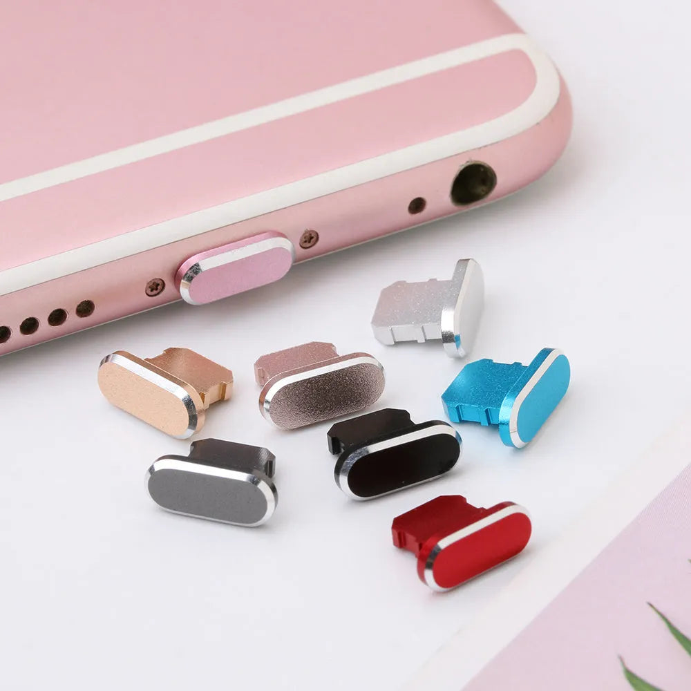 Aluminium alloy dust plug for iPhone charging port in various colours including gold and black.