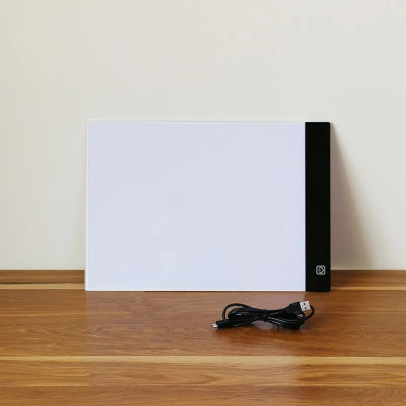 LED artist tracing table with acrylic panel and USB power, showing dimming function on a drawing surface