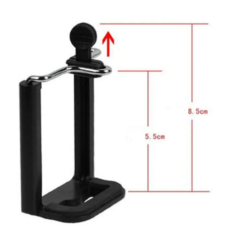 Black mini desktop camera tripod with extended legs and a U-shaped phone clip attached, on a white background.