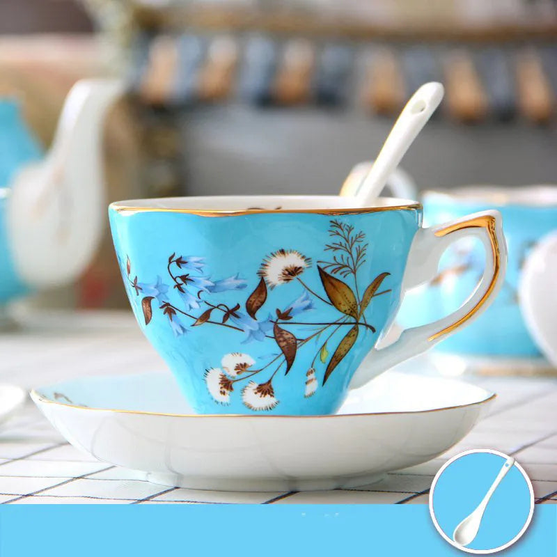 European style porcelain coffee cup set with saucer and pastoral ceramic plates on a dining table