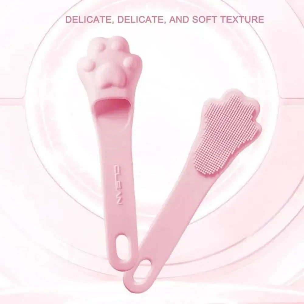 Silicone finger cover toothbrush for dogs and cats in pink, purple, yellow, and white.