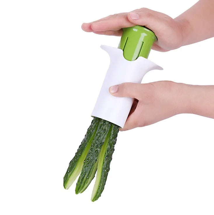 White ABS plastic vegetable slicer with stainless steel blades for cucumbers, carrots, and strawberries