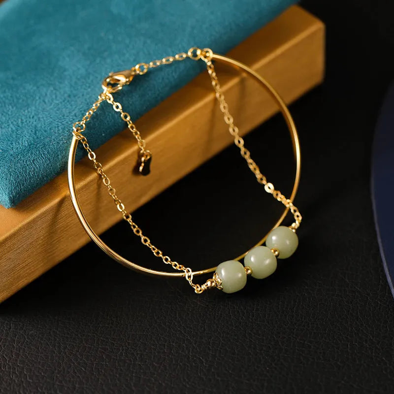 Women's jade lucky beads bracelet with gold inlay, shown in single, double, and three bead versions.