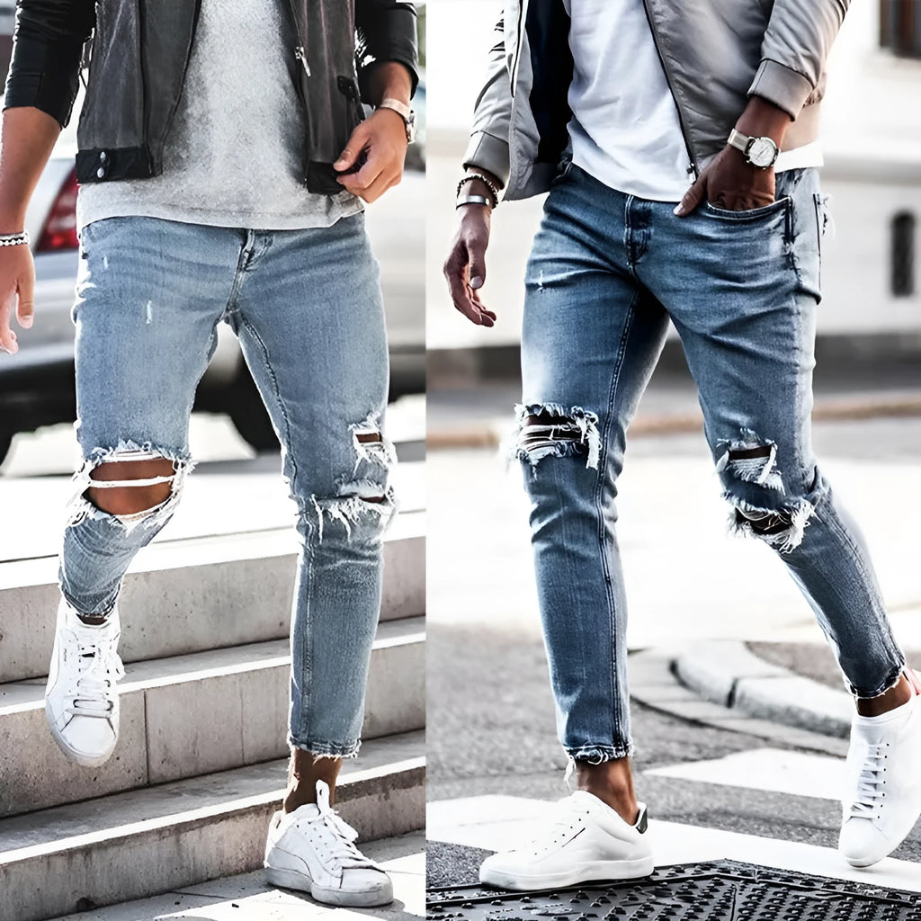 Men's light blue straight fit distressed jeans with embroidered details and zip fly