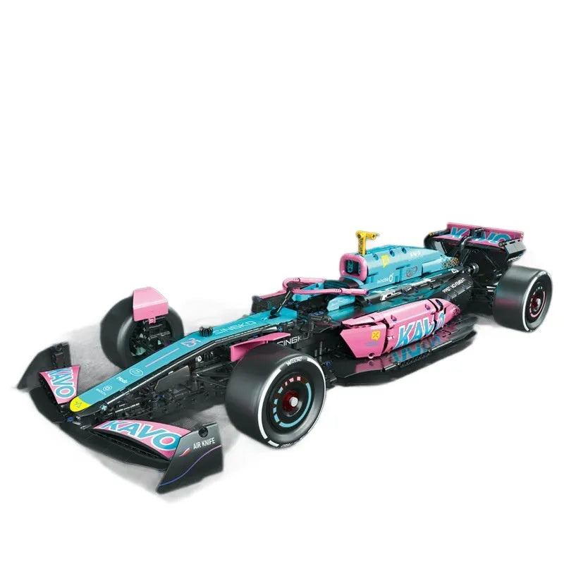 Mechanical F1 racing building blocks car in blue and pink with small plastic particles assembled on a surface