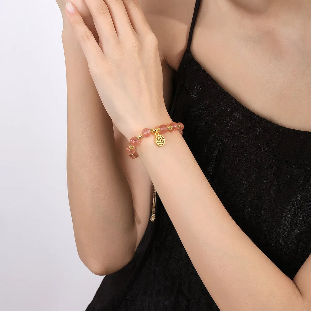 Pink strawberry quartz geometric bracelet with electroplated finish and fu character detail