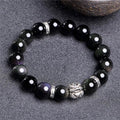 Natural obsidian bracelet with silver 999 clasp, showing cloud year pattern and lucky colour eye beads.