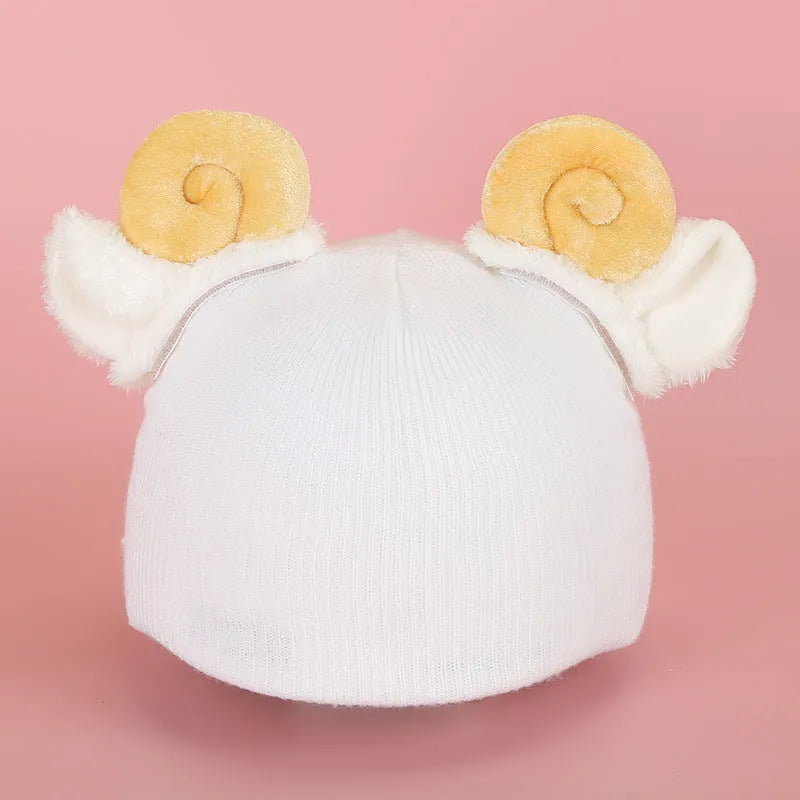 Soft plush cartoon character cover on a motorcycle helmet, showing size M and decorative ear sections.