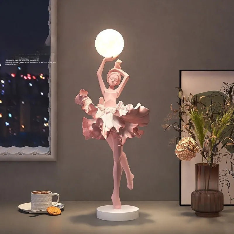 Small modern night lamp ornament in resin showing colour options: black gold, white, pink, and light blue.