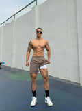 Man wearing ice silk quick-dry double-layer casual shorts in light grey.