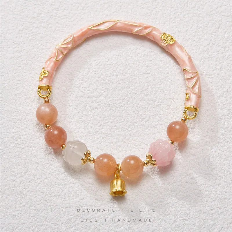 Chinese style sunstone jade bracelet with lily pattern and geometric gold thread design