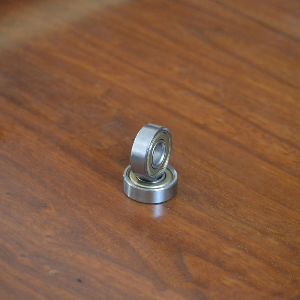 6000z carbon steel ball bearing showing 10mm bore, 26mm outer diameter, 8mm width, and iron cage.