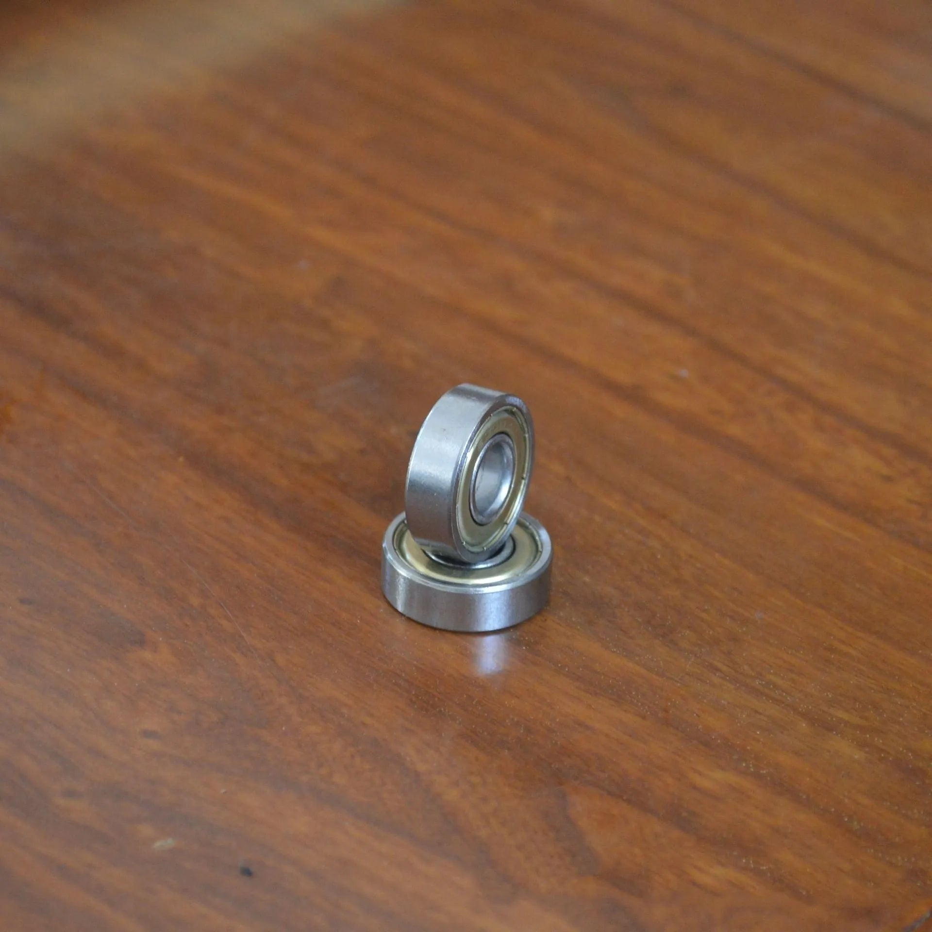 6000z carbon steel ball bearing showing 10mm bore, 26mm outer diameter, 8mm width, and iron cage.