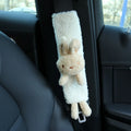 Cartoon plush lamb's wool shoulder protector for car seat belt in rabbit and bear designs.