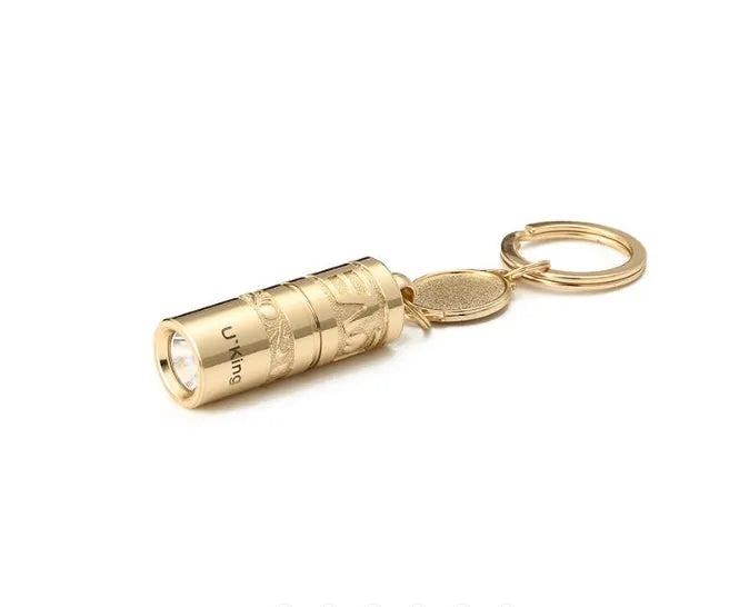 Gold-finish zinc alloy waterproof LED keychain torch with compact design for portable emergency lighting