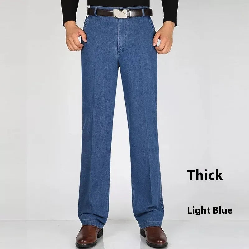 Men's high-waist loose fit blue denim jeans with zipper fly on size chart background