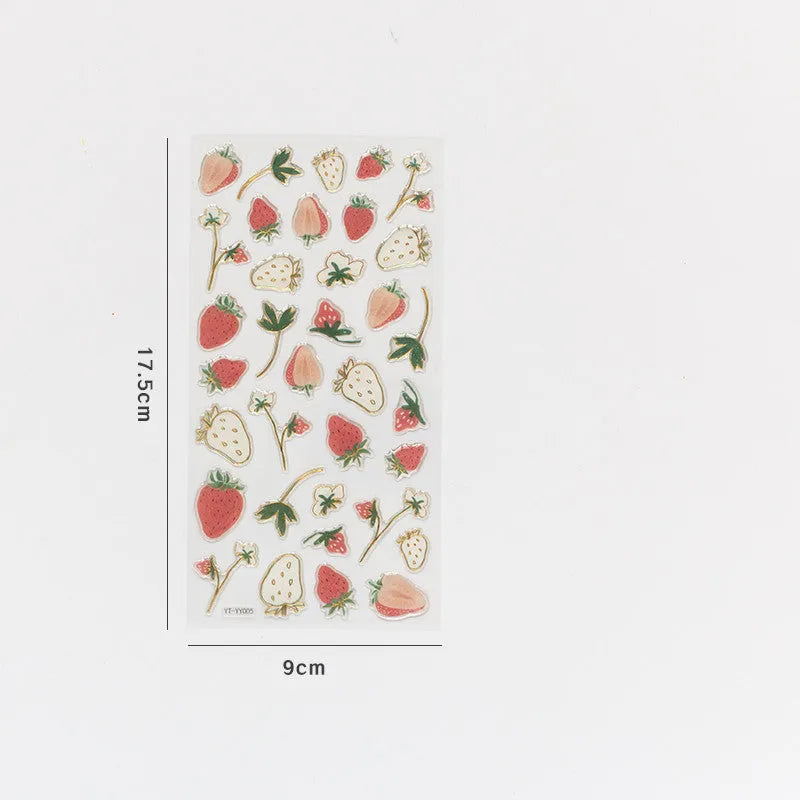 Sheet of DIY metallic gold fruit stickers including grape, orange, passion fruit, peach, pineapple, and strawberry designs.