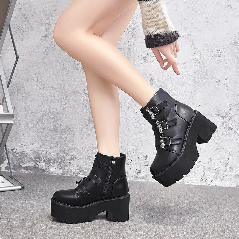 Black women's punk gothic short ankle boots with a bat buckle and side zip.
