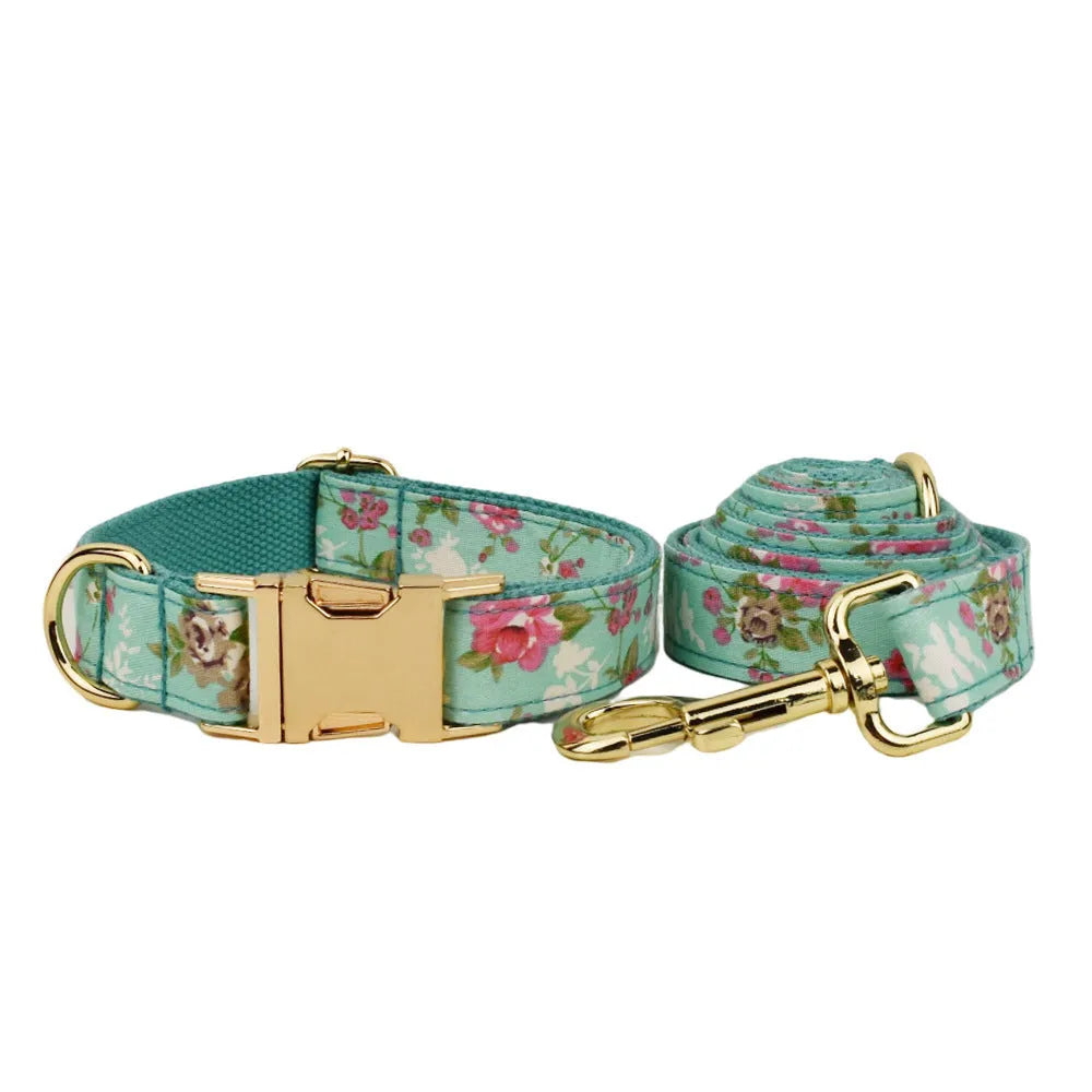 Rose patterned dog collar and leash set with green background, detachable bow, and matching cloth vest.