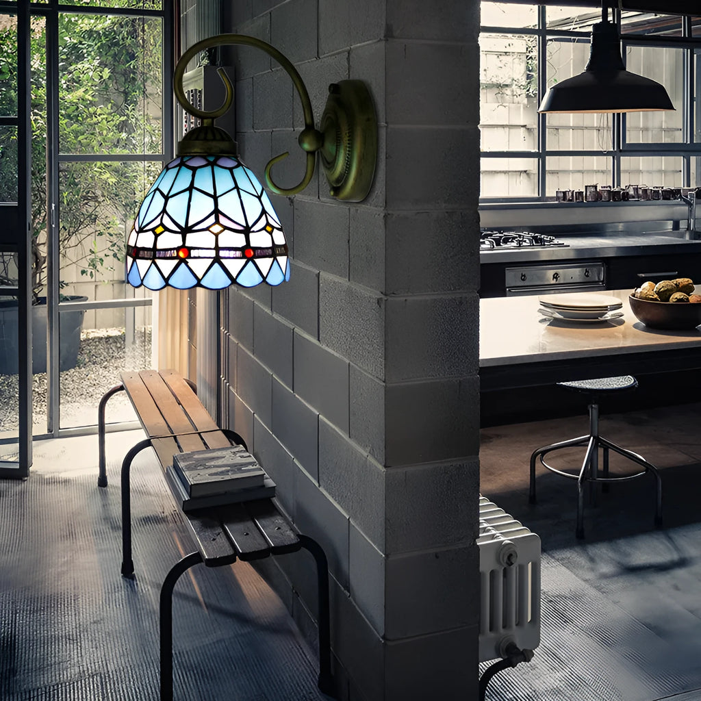 A coloured stained glass wall lamp designed for mounting in a corridor or hallway.