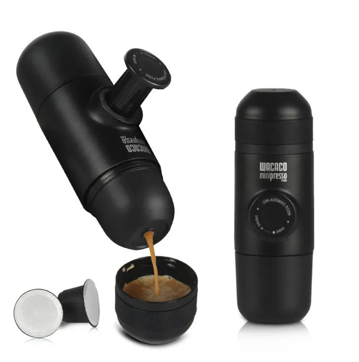 Black portable manual coffee machine showing compact size and manual operation components.