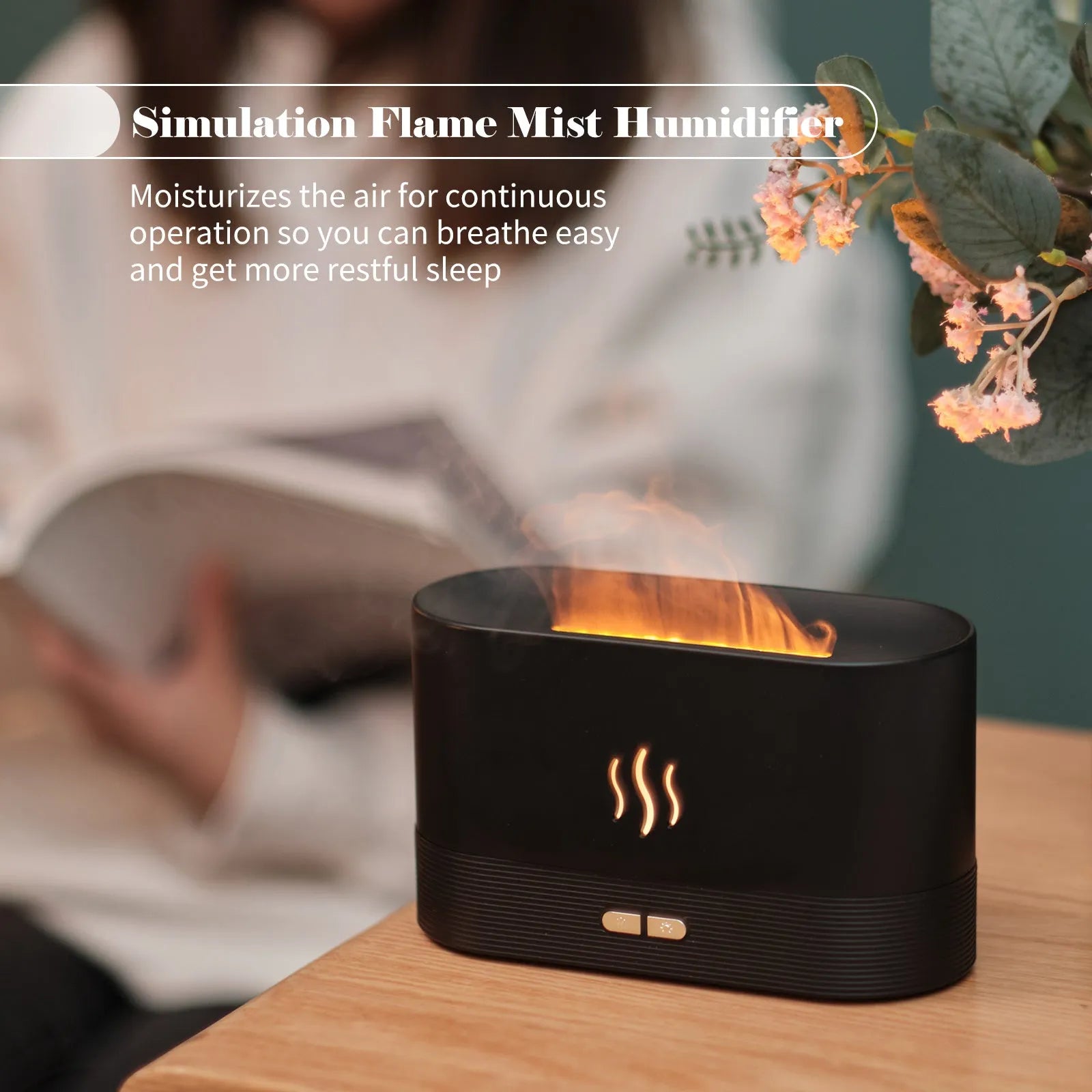 Square black ultrasonic aroma diffuser with flame light effect and water tank on a wooden table.