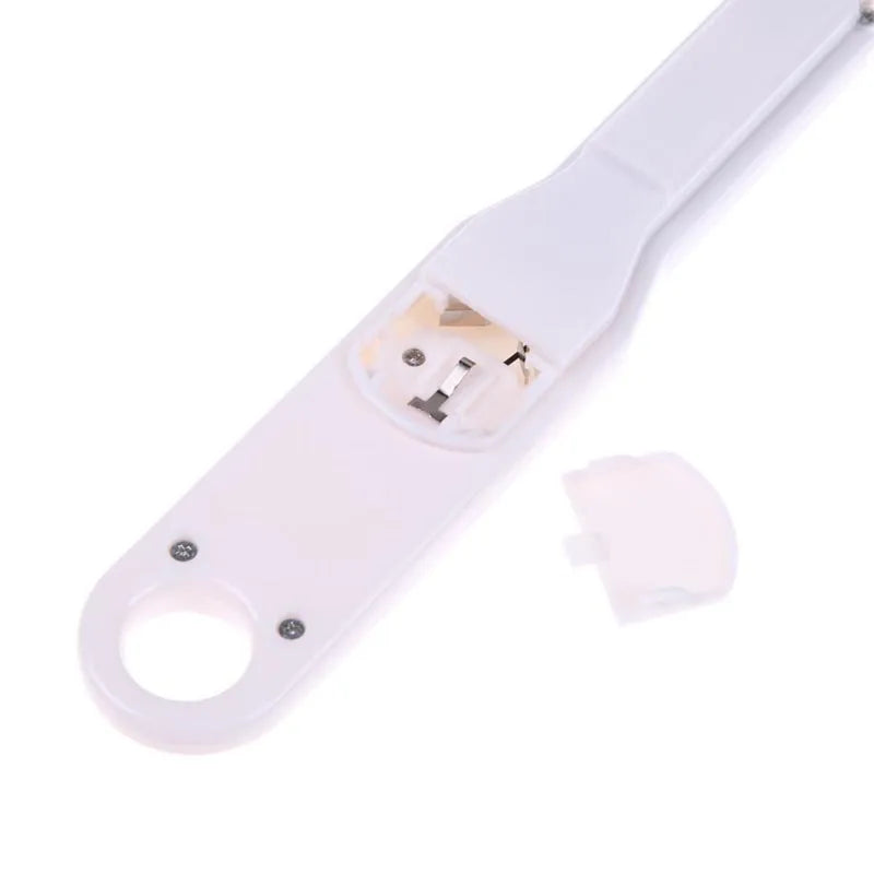 White digital spoon scale with LCD display showing weight measurement for kitchen use