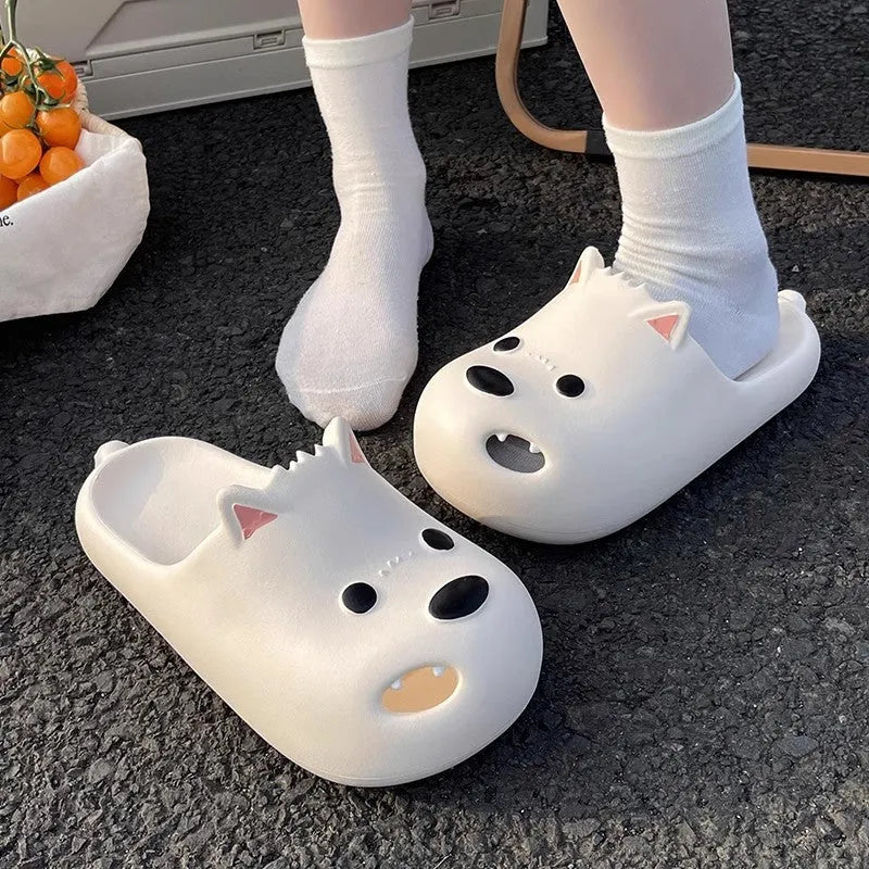Women's black and white EVA puppy slippers with toe cap sandal design on a white background.